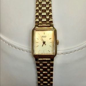 Seiko stainless steel quartz gold face dress watch